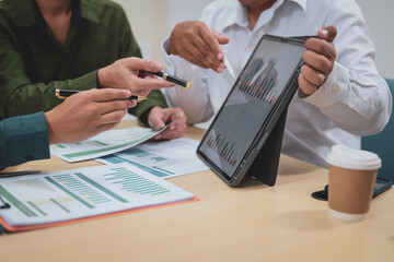 Fototapeta premium A businessman,embodying strategic leadership, sits at his desk in a modern office, planning and managing departments systematically to ensure organizational success through effective administration