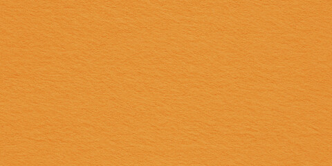 a seamless texture of slightly textured colored paper in honey orange color