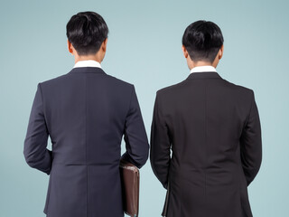 Back view of office workers, back view of business people, two men in suits