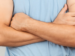 Crossed arms. A person with arms crossed