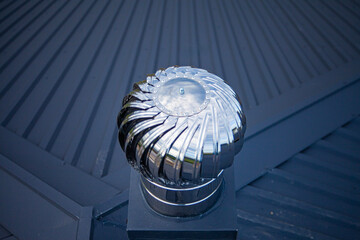 stainless steel deflector on the roof of the building, connected to the exhaust system and supply...