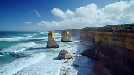 Twelve Apostles: The dramatic limestone stacks of the Twelve Apostles along the Great Ocean Road, with waves crashing below.
