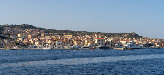 Fototapeta premium La Maddalena village in the namesake archipelago, next to Sardinia island, Italy, seen from offshore, surrounded by nature. A famous natural tourist destination