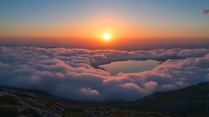 Sunrise Over a Sea of Clouds and a Hidden Lake