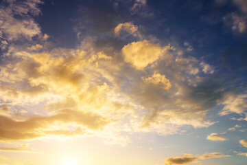 Fototapeta premium Dramatic cloudy sky at sunset or sunrise. Nature. Vintage film aesthetic.