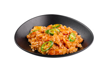 Spicy chicken and rice dish being served on black plate