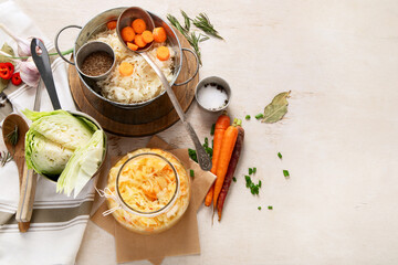 Winter salad of marinated cabbage and carrot Homemade sauerkraut in a jar on wooden background