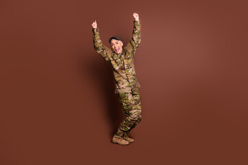 Full body photo of attractive mature woman army soldier winning raise fists wear military uniform...