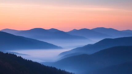 Obraz premium Misty Mountain Silhouette at Sunset