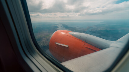 view from the airplane window of the airport during takeoff
