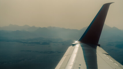 view from the airplane window of the airport during takeoff