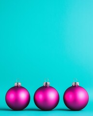 Obraz premium Three vibrant pink Christmas tree ornaments lined up against a bright turquoise background. Christmas and New Year festive concept with copy space.