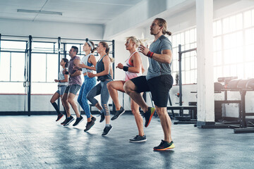 Fitness, people and exercise with warm up for leg training, wellness and body workout. Team, cardio...