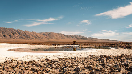 The unique landscape of Baltinache Lagoons surrounded by salt flats and mountains in Atacama Desert, San Pedro de Atacama, Chile..