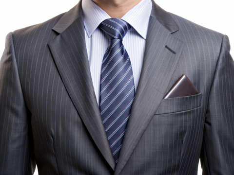 A man in a gray pinstripe suit jacket with a blue striped tie and a white shirt - Powered by Adobe