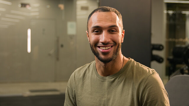 Sport channel video blog fitness vlog stream Latino American man guy athlete sportive fit instructor blogger vlogger influencer in gym talking at camera online workout training exercise tutorial chat - Powered by Adobe