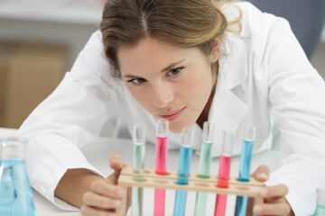 woman in lab with alb and pipettes