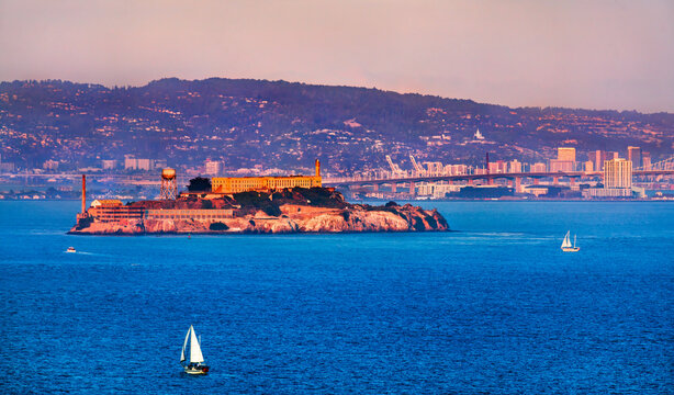 Sunset View of Alcatraz Island with Sailboats in San Francisco Bay - California, United States