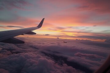 Obraz premium Airplane Wing Overlooking Sunset Clouds