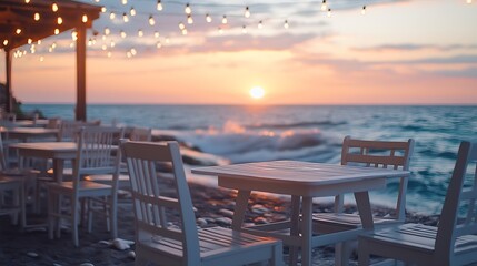 White wooden chairs and tables of a beachfront restaurant under string lights offering a romantic view of the sunset over a rough sea : Generative AI