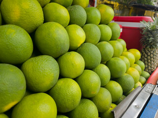 Close up shot of Mosambi fruit which is also know as Sweet Lemon in fruit seller cart.