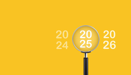 Magnifying glass magnifies the year 2025 on yellow background. Focusing on the year 2025 for business planning concept.