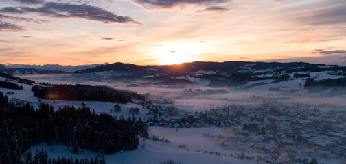 Sunset in Allgäu in the german alps in winter
