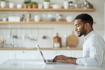 Smiling young African man in a plaid shirt, writing in a notebook while sitting in a bright, naturally lit room with plants in the background, exuding positivity and productivity in a casual, yet prof