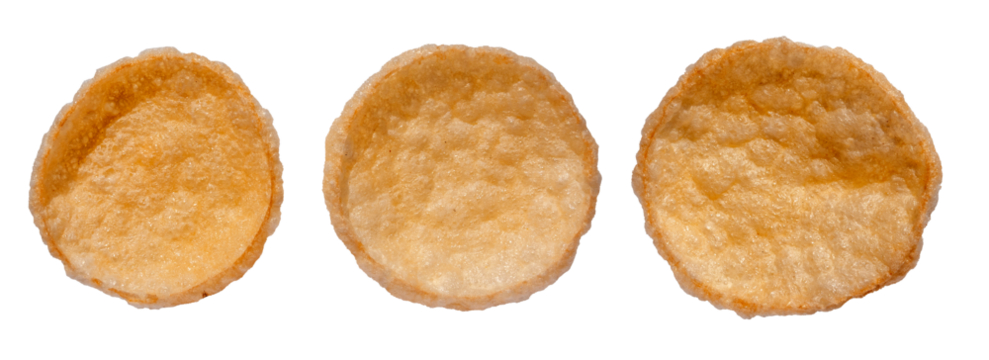 Well Baked Chips Isolated On a White Background. Salty Crispy Potato Snack. Round Shaped Crisps. Round Potato Puffs. Party Food.Thin, Crunchy Cereal Wafers, Perfect Party Snack. Well Done Salty Snack.