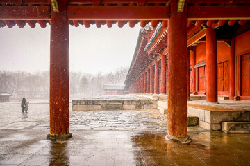 The snowy scenery of Jongmyo Shrine in Seoul, South Korea.