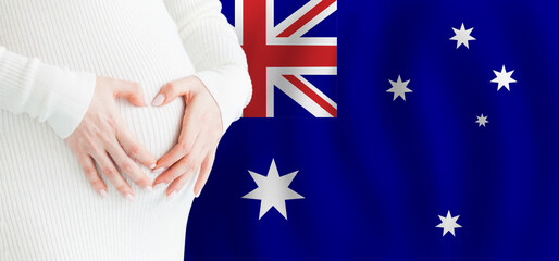 Demographics, pregnancy and love baby in Australia concept. Pregnant woman making heart against her...