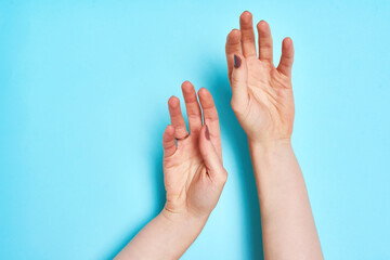 Hands, skincare and space with person in studio on blue background for natural peace or wellness. Arms, beauty or relax and model satisfied with cosmetic or dermatology treatment closeup on mockup