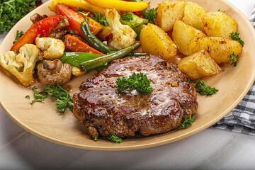 Roasted beef steak with potato