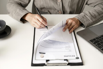 Business woman employer holding resume hiring recruit looking cv resume to hire candidates,...