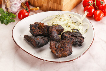 Grilled beef barbecue served onion
