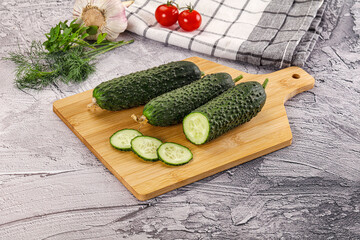 Raw green cucumbers with slices