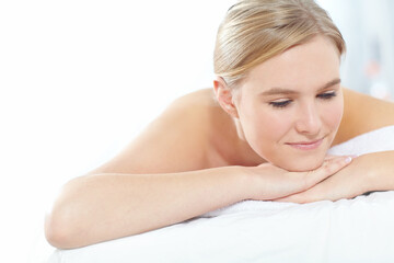 Fototapeta premium Massage, pamper and relax with woman at spa as customer on table for break, treatment or wellness. Luxury, peace and satisfaction with person on bed as salon client for comfort or stress relief