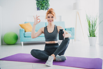 Photo of active attractive charming woman recommend organic supplement home okey sign house indoors