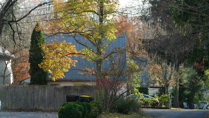 The beautiful little town landscape with the colorful autumn leaves and old buildings in USA