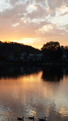 Obraz premium The beautiful sunset view with the colorful sky and river as background in a little USA town 