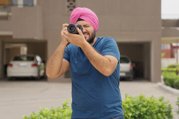 Sikh Indian Man Clicking Picture with Camera