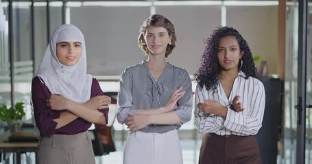 Indian Asian happy young adult gen z proud women lady wear hijab scarf fold hand look cam indoor work place teen mix girls curly hair expert female staff group team cross arms do pose job office day