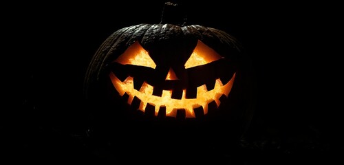 Fototapeta premium Halloween pumpkin on a dark background