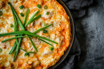 In this close-up, you can see the Korean Buldak Fire Chicken, which has been marinated in Korean spices and topped with tons of mozzarella cheese. It is stir-fried with Korean spices before being