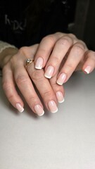 The beauty of the natural nails. Perfect clean manicure. New trendy nail arts on young women hand. Beautiful nail polish in hand