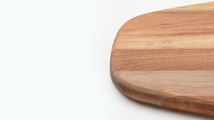 Closeup detail of wooden cutting board on copy-space background.