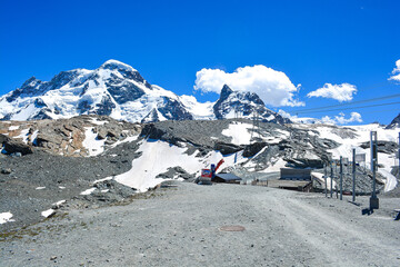 Swiss Alps peaks and ridges covered in snow in Summer. 