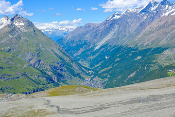 Swiss Alps peaks and ridges covered in snow in Summer. Stunning mountain landscape in Switzerland. Panoramic shot. Space for copy. 