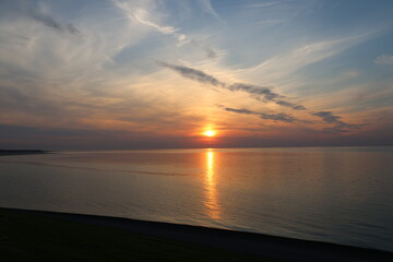 as the sun sets on a summer's day