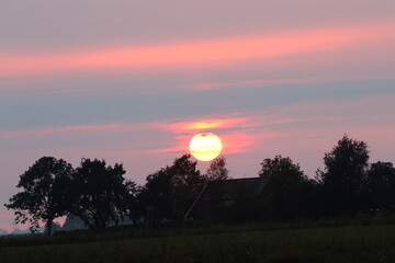 as the sun sets on a summer's day